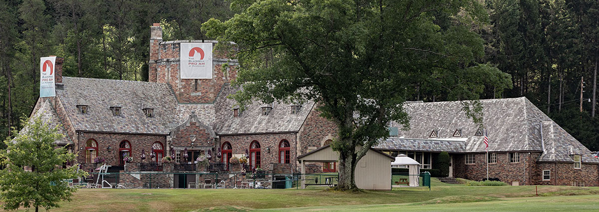 Historic Pennhills Clubhouse in a scenic setting.